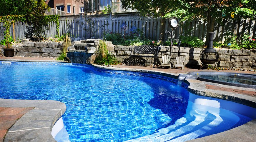A pool with water falling into it.
