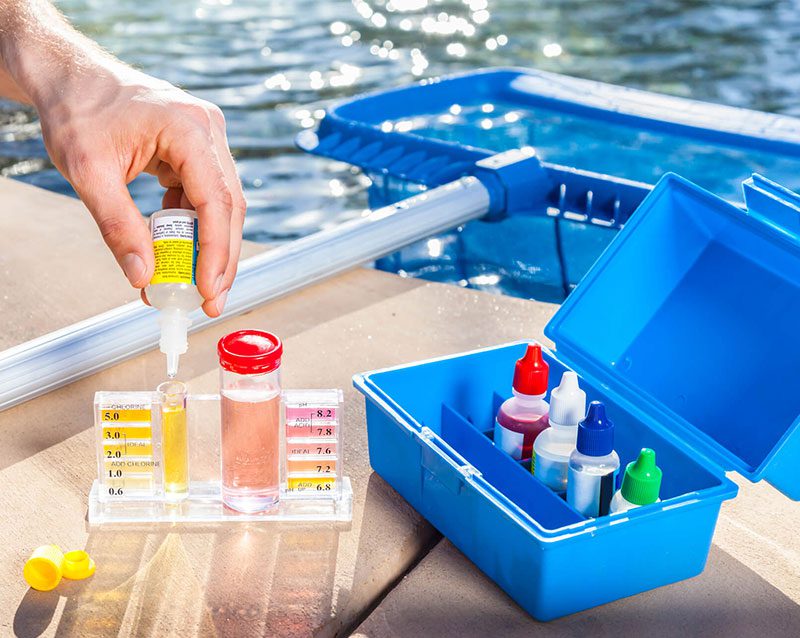 A person is filling up containers with liquid.